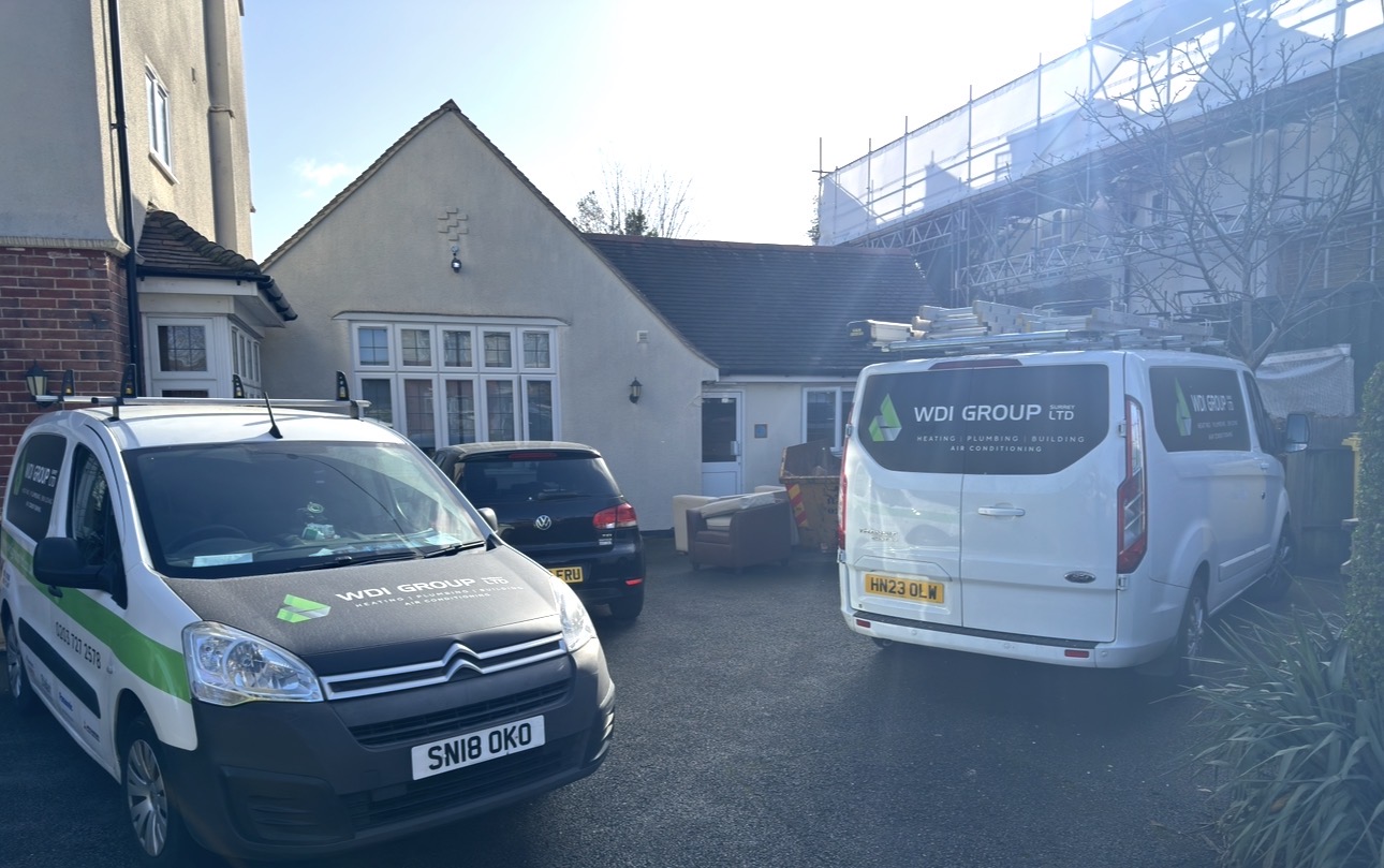 WDI Group vans parked outside a customer's home before a plumbing appointment